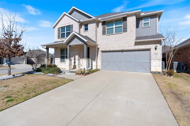 view of front of property featuring a garage, a porch, cooling unit, and a front lawn