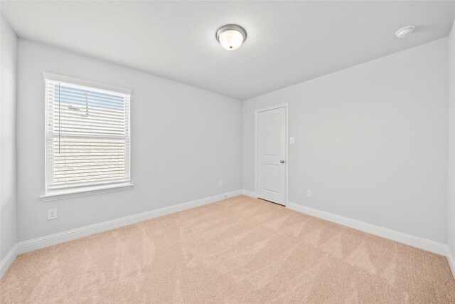 6225 Kent Ln, Celina, TX 76227 - empty room with light carpet, baseboards, and a smoke detector