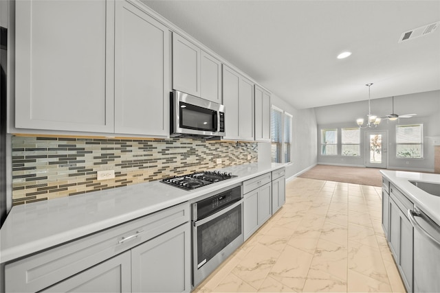 6225 Kent Ln, Celina, TX 76227 - kitchen featuring stainless steel appliances, light marble finish flooring, decorative backsplash, light countertops, and recessed lighting
