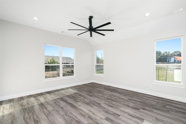 unfurnished room with ceiling fan, dark hardwood / wood-style flooring, and vaulted ceiling