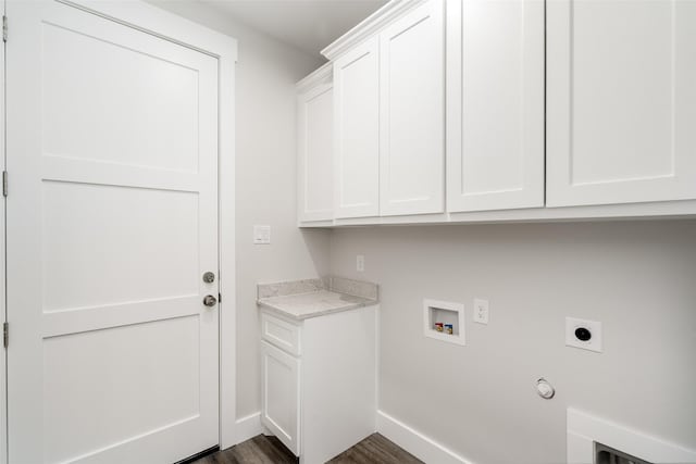 laundry room with dark wood-type flooring, cabinets, electric dryer hookup, gas dryer hookup, and hookup for a washing machine