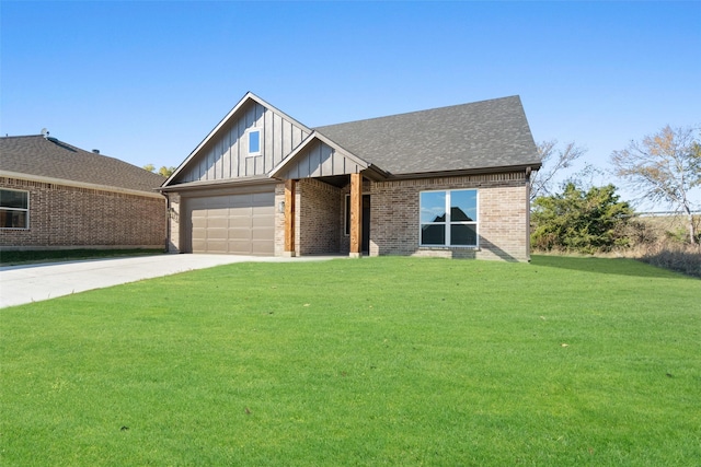 view of front of house featuring a garage and a front yard