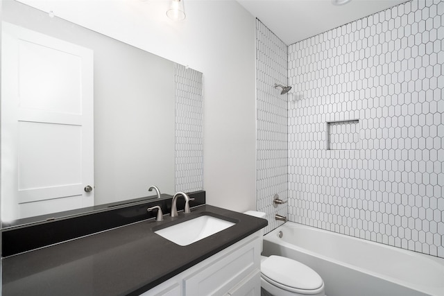 full bathroom featuring vanity, toilet, and tiled shower / bath combo