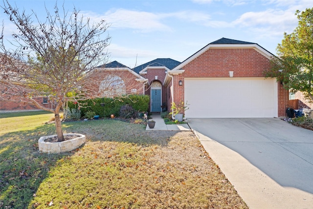 view of front of property with a front yard and a garage