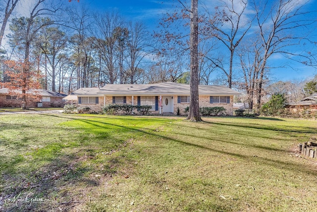 ranch-style house with a front lawn