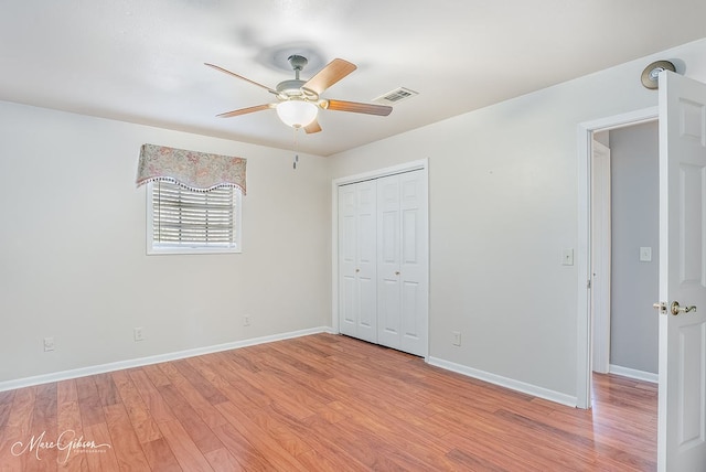 unfurnished bedroom featuring a closet, ceiling fan, and light hardwood / wood-style flooring