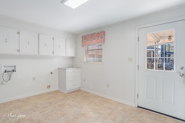 laundry area featuring hookup for a gas dryer, cabinets, and washer hookup