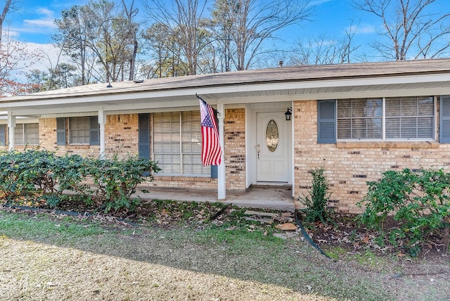 ranch-style home with covered porch