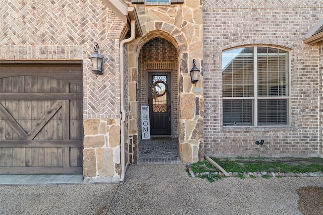 doorway to property featuring a garage