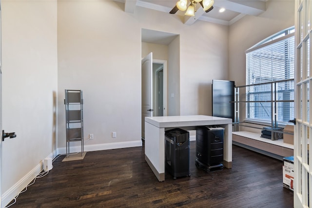 office area featuring beam ceiling, ceiling fan, a healthy amount of sunlight, and dark hardwood / wood-style floors