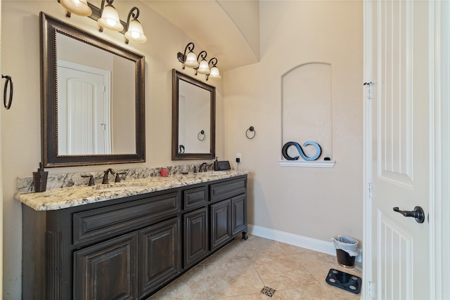 bathroom featuring tile patterned flooring and vanity