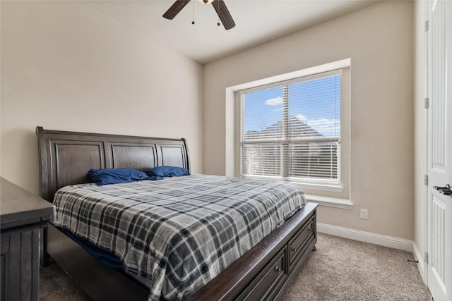 bedroom with ceiling fan and light carpet