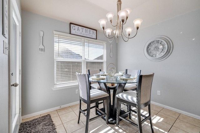 tiled dining area with an inviting chandelier