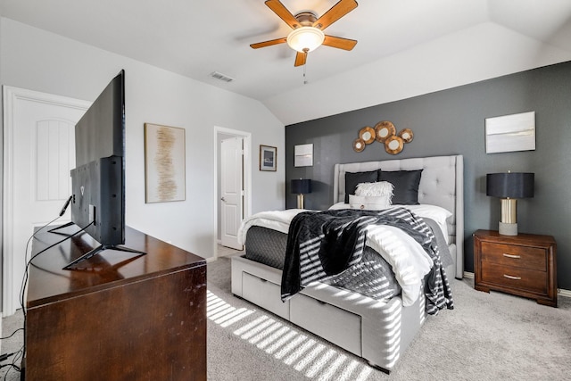 carpeted bedroom featuring ceiling fan and vaulted ceiling