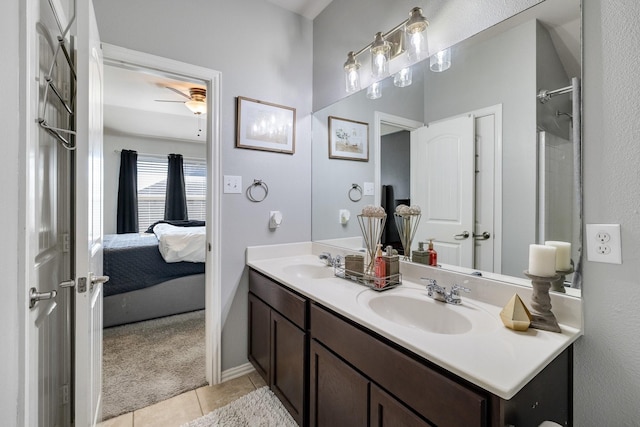 bathroom featuring tile patterned flooring, vanity, and ceiling fan