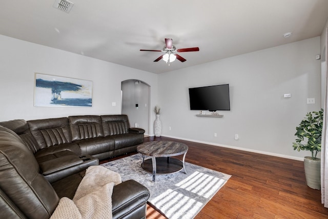 living room with hardwood / wood-style flooring and ceiling fan