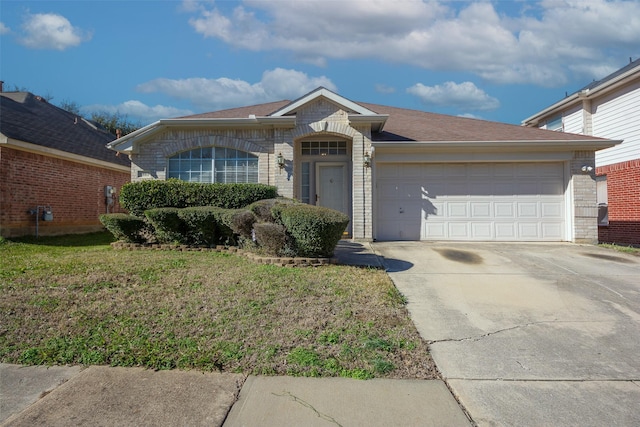 ranch-style home with a front yard and a garage