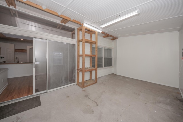 empty room featuring concrete flooring and sink