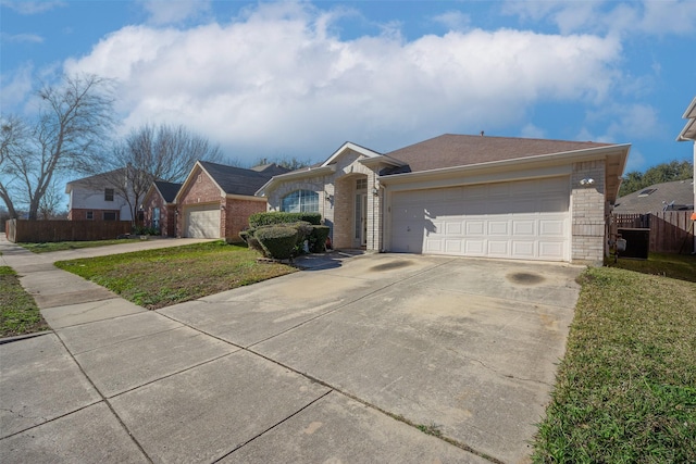 ranch-style house featuring a garage and a front lawn