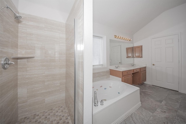 bathroom with plus walk in shower, vanity, and lofted ceiling