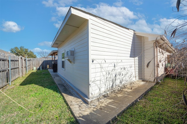 view of side of home featuring a yard