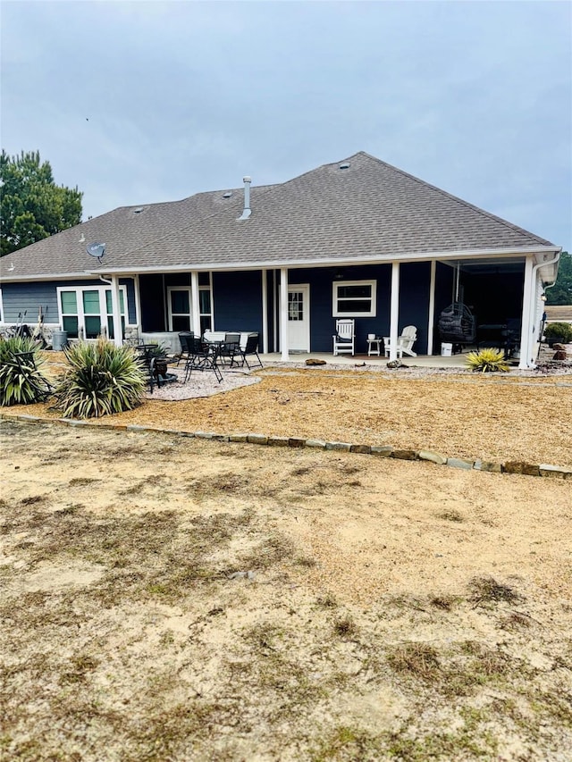 rear view of property featuring a patio