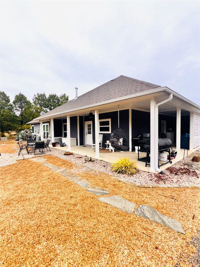 back of property featuring a patio area