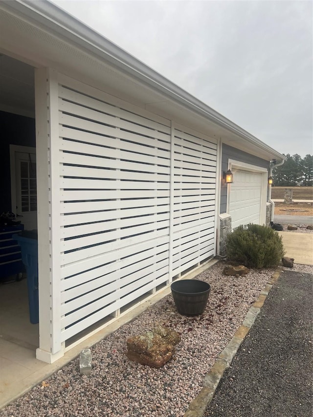 view of side of home featuring a garage