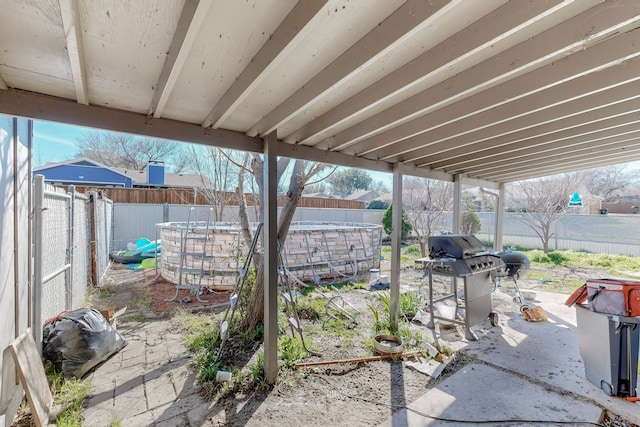 view of patio with a grill and a pool