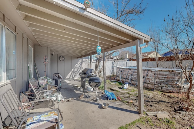 view of patio with a pool and a grill