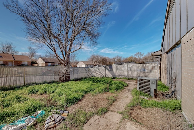 view of yard with central AC