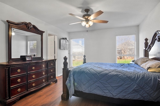 bedroom featuring ceiling fan and dark hardwood / wood-style floors