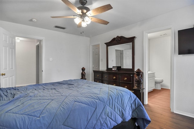 bedroom featuring connected bathroom, ceiling fan, and hardwood / wood-style flooring