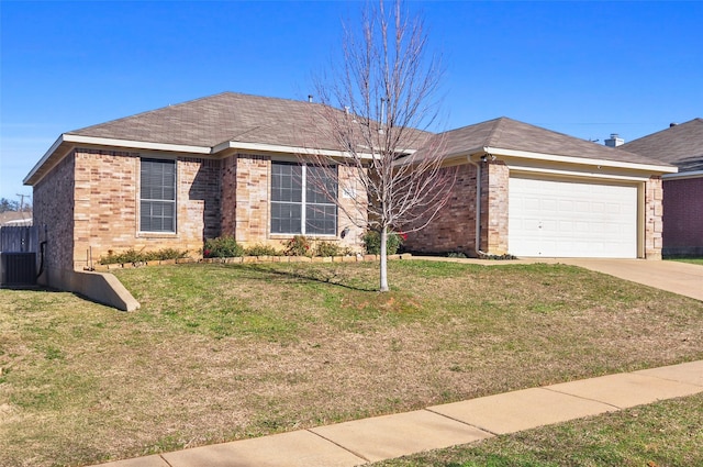 single story home with a garage, a front yard, and central AC unit