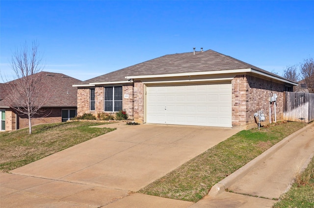 ranch-style house with a garage and a front yard