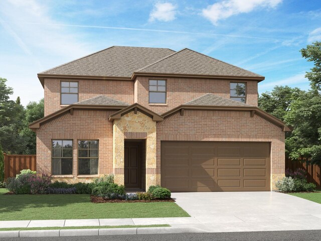 view of front of property with a garage and a front yard