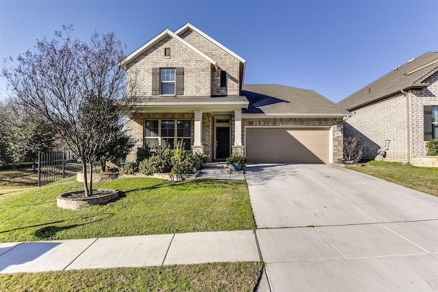 view of front of home featuring a front yard and a garage