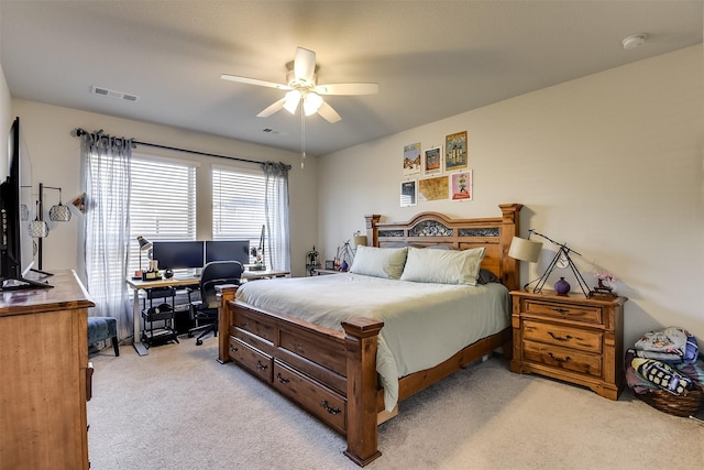 bedroom featuring light carpet and ceiling fan