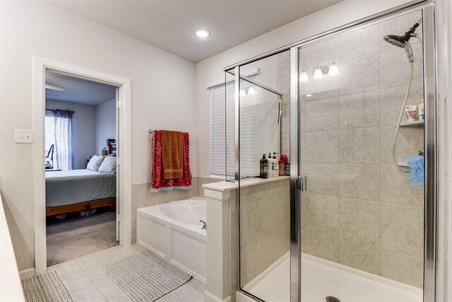 bathroom featuring separate shower and tub and tile patterned floors