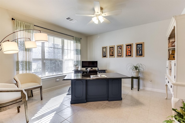 office with ceiling fan and light tile patterned floors