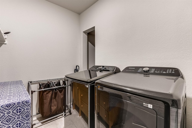 clothes washing area featuring washing machine and clothes dryer