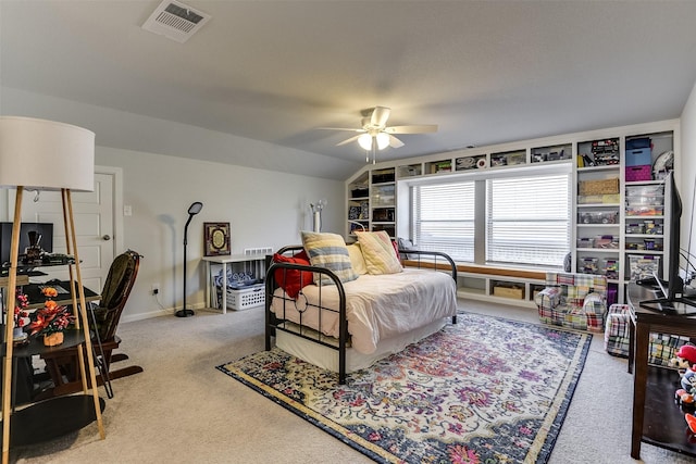 bedroom with ceiling fan, light colored carpet, and lofted ceiling