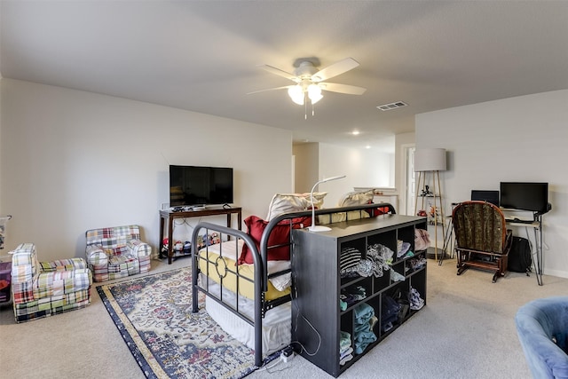 living room with ceiling fan and carpet