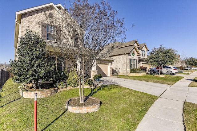 view of front of home with a front lawn and a garage