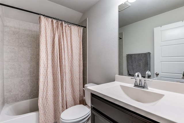 full bathroom with vanity, shower / bath combination with curtain, and toilet