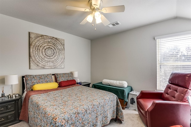 bedroom with ceiling fan, light colored carpet, and lofted ceiling