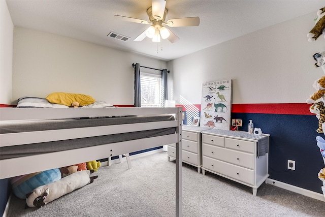 bedroom with ceiling fan and light colored carpet