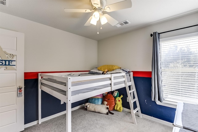 bedroom with ceiling fan and light colored carpet