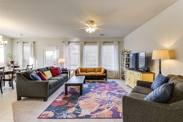 living room with light tile patterned floors and ceiling fan