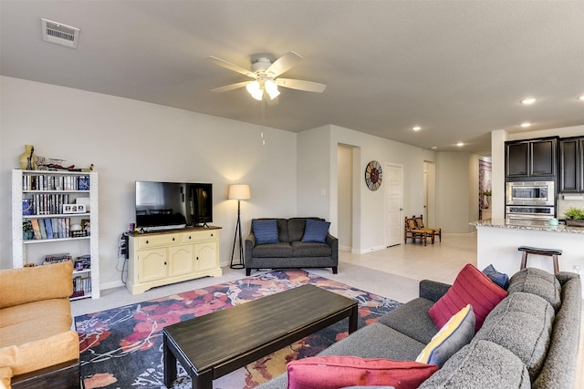 living room featuring ceiling fan